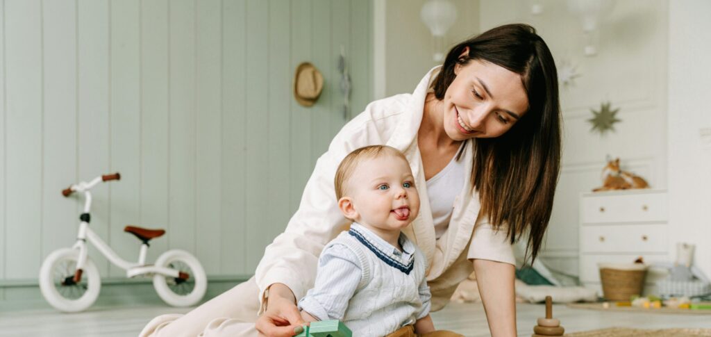Woman with Small child playing on the floor